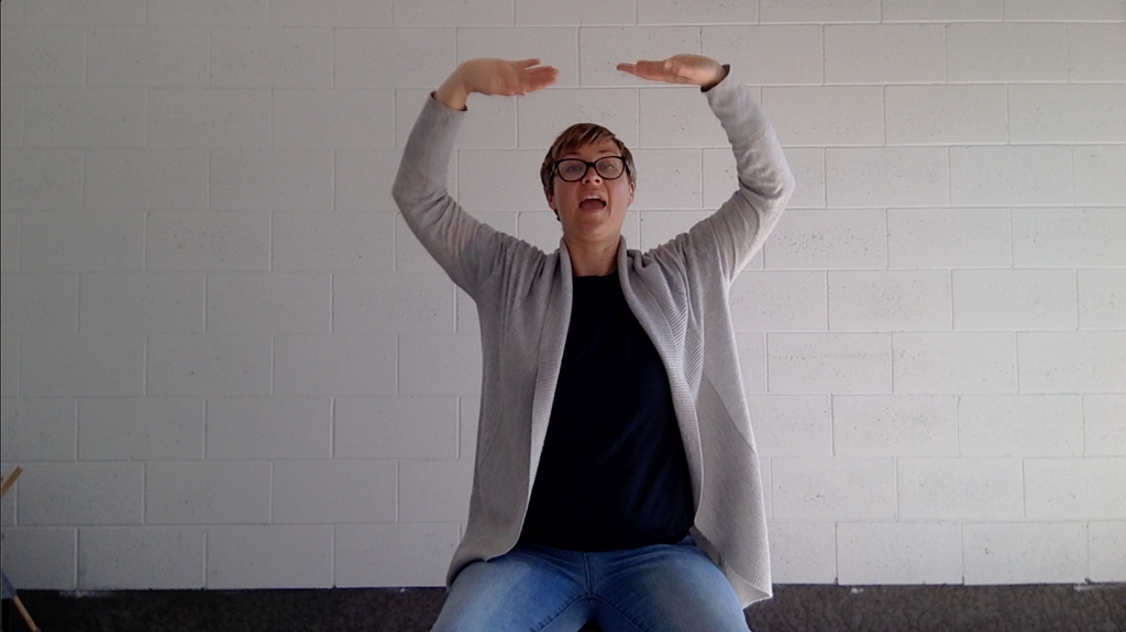 Emily Drysdale from Bliss Calm Qigong doing Seated Qigong for Less Stress